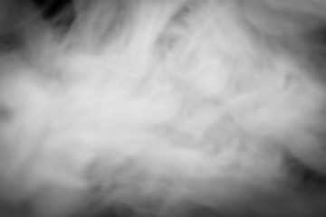 Blurred movement of smoke in the dark. Abstract background.