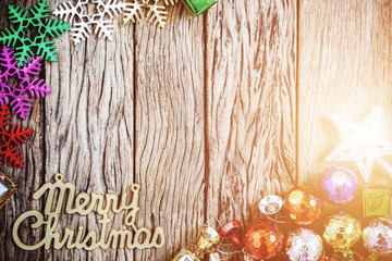 The word "Merry Christmas" with decorative on wood background. V