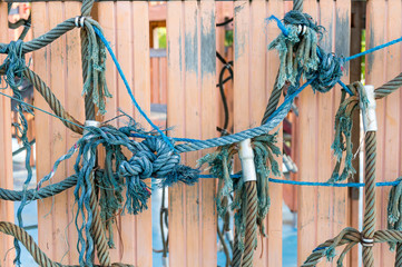 Old and damage of climbing net for children at the playground