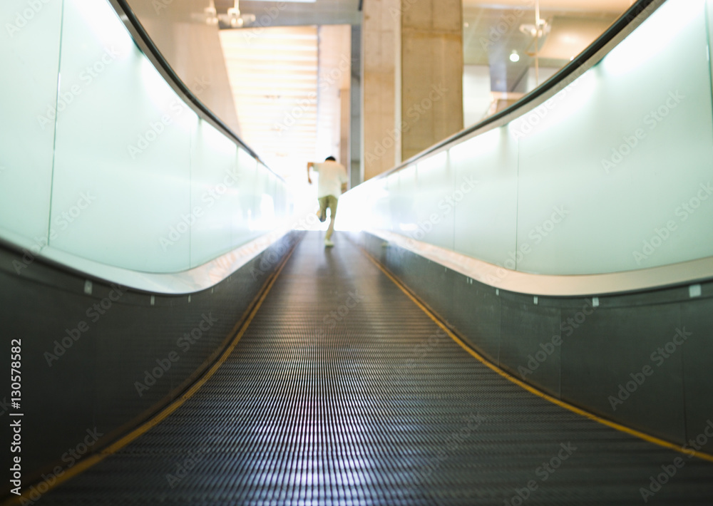 Poster Man running on moving sidewalk