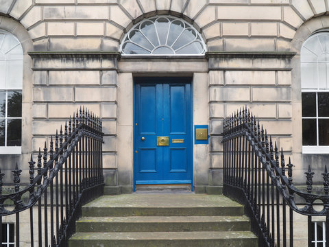 Front Door Of Old Stone Faced Apartment Building