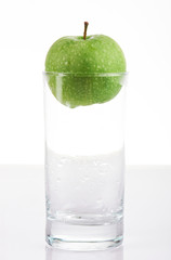 empty glass with green apple