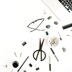 Flat lay, top view office table desk. Workspace with laptop, scissors, glasses, pen on white background.