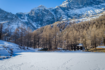 Frozen Lago Blu with chalet in background