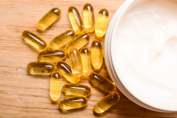 Set of care cream and Fish oil capsules with omega 3 and vitamin D. Beauty and health concept