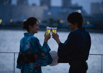 Couple in yukatas toasting