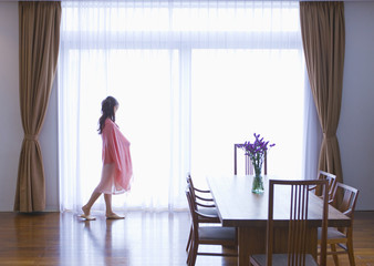 Woman standing by the window