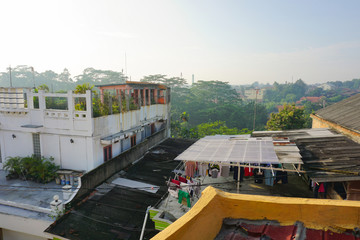 Fototapeta na wymiar rooftop building with trees and bush photo taken in depok jakarta indonesia
