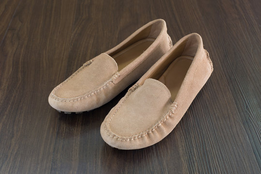 Men shoes on brown wooden floor