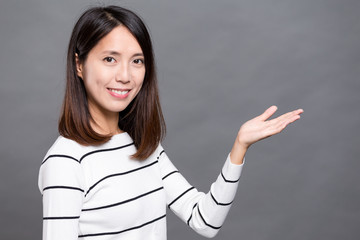 Asian woman showing open palm