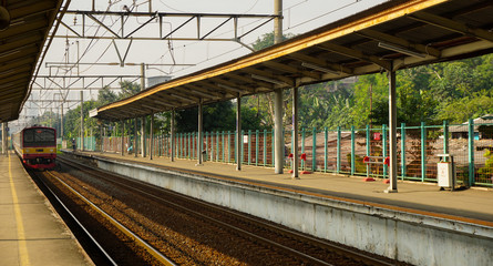 train coming commuter line railway in station taken in depok indonesia