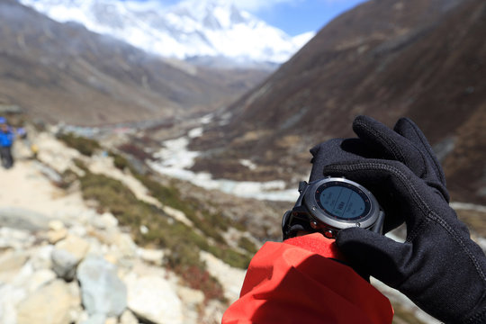  set the sports watch trekking on himalaya mountains - Powered by Adobe