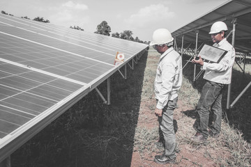 engineer working on checking and maintenance equipment in solar power plant