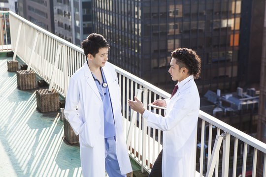 Doctors talking on the hospital's rooftop