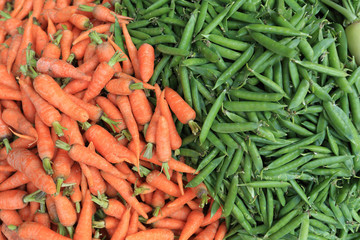fresh carrots and green peas selling at the street shop