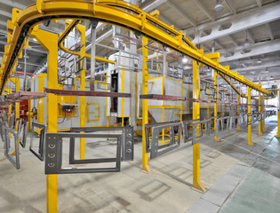 industrial workshop for the assembly of oven on a conveyor belt