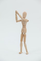 Wooden figurine standing with both the hands joined