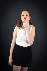Beautiful woman doing different expressions in different sets of clothes: yawn