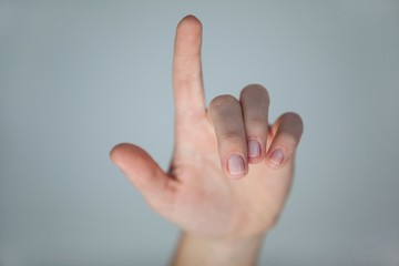 Hand of a woman pointing upwards