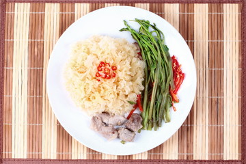 Thai spicy fried snow fungus mushroom with morning glory.
