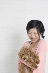 Woman holding pet dog