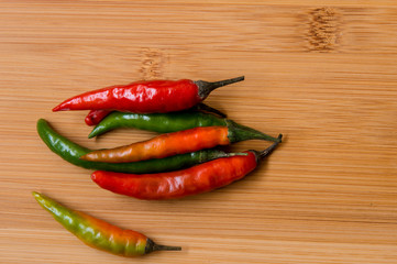 Chilies red & Green on wood surface, top view 