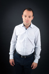 Fototapeta premium Handsome Man doing different expressions in different sets of clothes: tired