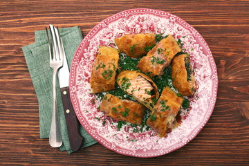 Salmon fillet and spinach with cheese baked in puff pastry