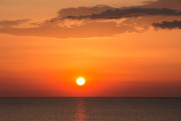 Fiery sunrise at Italian beach. Summer season. Emilia Romagna region. Adriatic sea. Italy