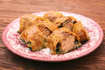 Salmon fillet and spinach with cheese baked in puff pastry