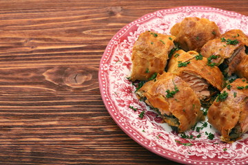 Salmon fillet and spinach with cheese baked in puff pastry
