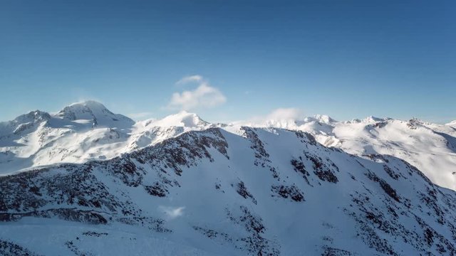 Clouds in the snowy alps time lapse