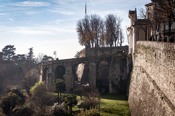 Ruins of old bridge at old town Cita Alta of Bergamo town in Italy