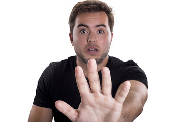 Man holding up hands as a stop gesture on a white background