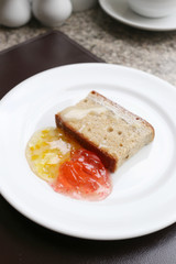 dessert baked or fruit bread on white dish.