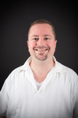 Fototapeta premium Handsome man doing different expressions in different sets of clothes: smile