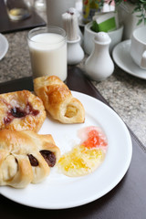 dessert baked or fruit bread on white dish.