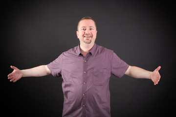 Fototapeta premium Handsome man doing different expressions in different sets of clothes: welcome