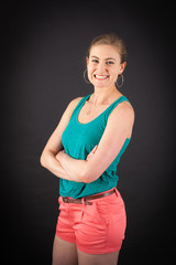 Beautiful woman doing different expressions in different sets of clothes: arms crossed