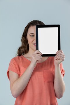 Beautiful woman holding a digital tablet 