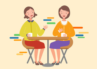 Two woman talking and drinking coffee in a cafe.