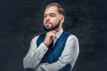 Thoughtful and elegant  business man wearing waistcoat.