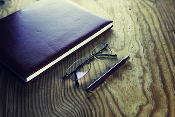 business pen glasses notebook