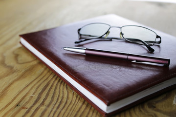 pen business wallet glasses notebook