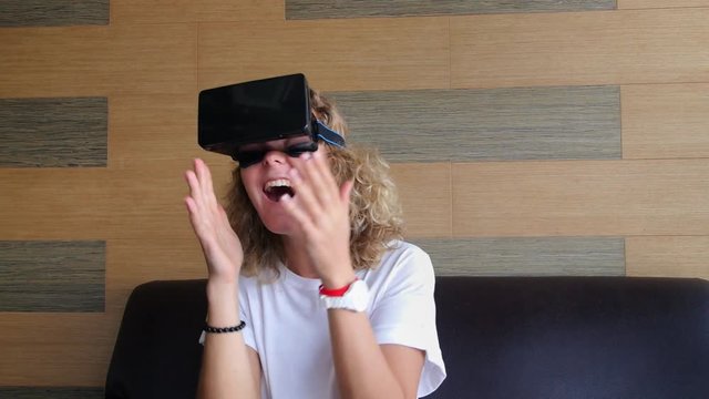 Attractive Woman Using VR-Headset Glasses