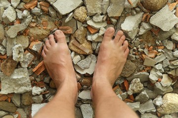 Bare feet on the stones.