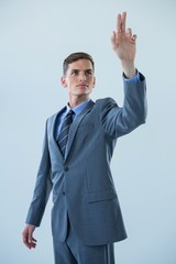 Businessman touching an invisible screen