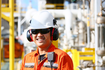 operator recording operation of oil and gas process at oil and rig plant, offshore oil and gas industry, offshore oil and rig in the sea, operator monitor production process, routine daily record.