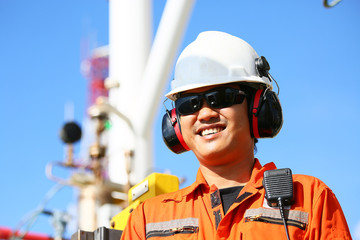 operator recording operation of oil and gas process at oil and rig plant, offshore oil and gas industry, offshore oil and rig in the sea, operator monitor production process, routine daily record.