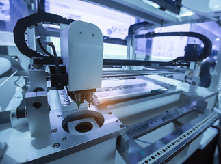 Robotic arm at production line in factory
